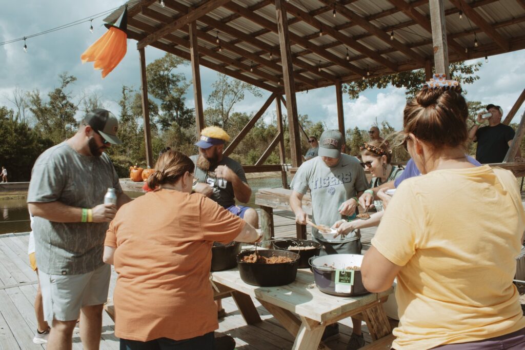 Guests gathering for a cookout under the pavilion at Fireside RV Resort in Ponchatoula, Louisiana.