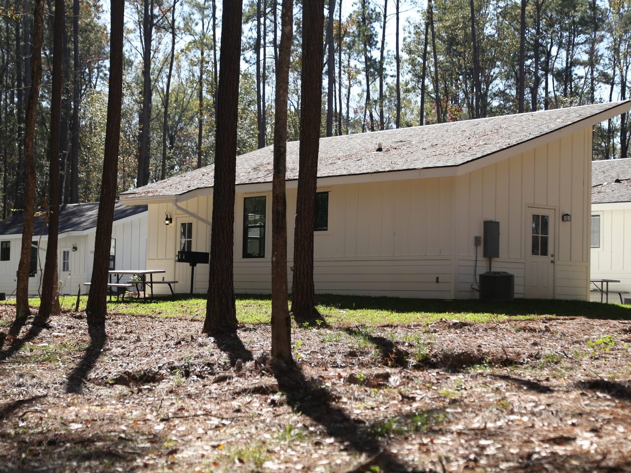 Fireside RV Resort cabin exterior among the pines in Ponchatoula Louisiana