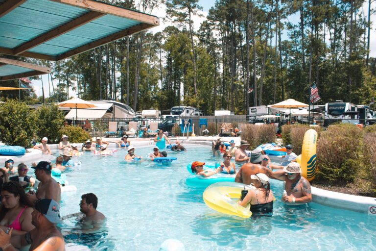 Guests floating the lazy river on a sunny summer day at Fireside RV Resort near New Orleans