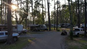 Full-hookup RV sites at dusk at Fireside RV Resort near New Orleans
