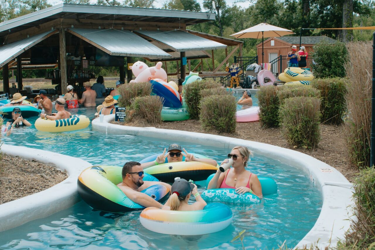 Guests floating the lazy river at a Northshore Louisiana glamping resort