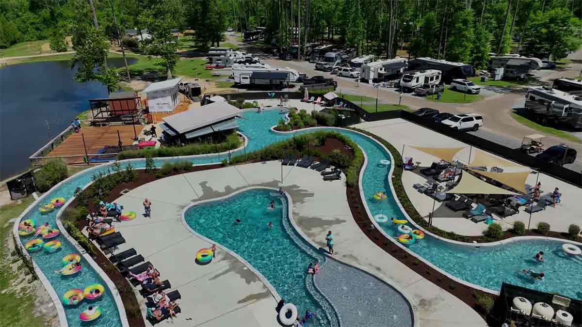Aerial view of guests floating the lazy river and pool complex at Fireside RV Resort near New Orleans