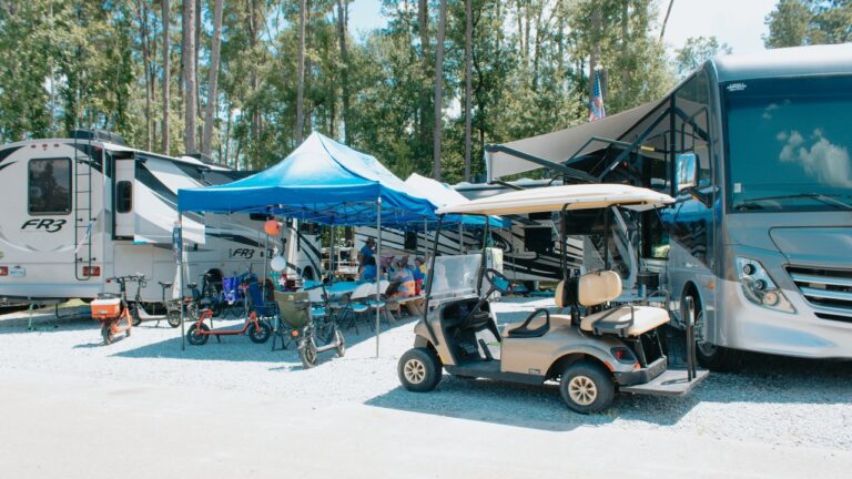 RVs and a golf cart at a full-hookup Northshore campground site in Ponchatoula, Louisiana