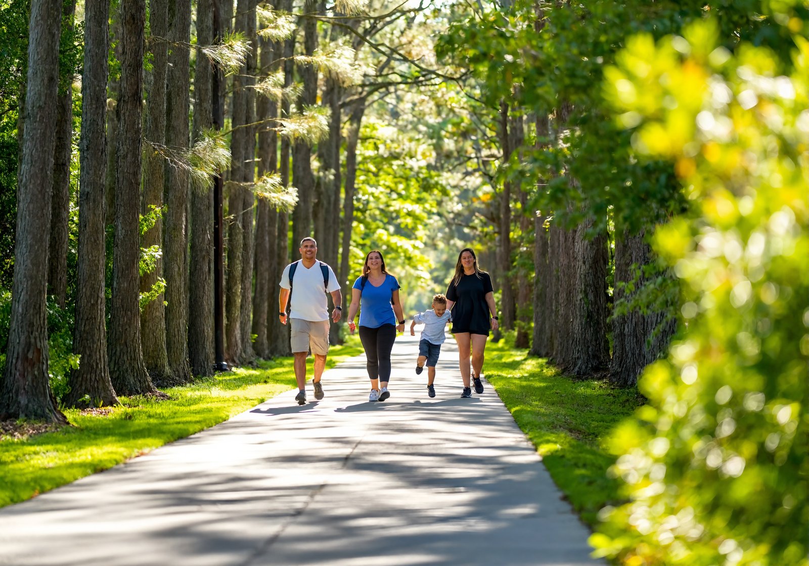 Family walking a paved rail trail on Louisiana's Northshore near the campgrounds