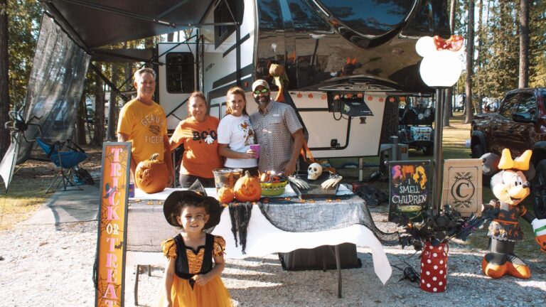 A family in costumes at their decorated RV site during the Halloween Spooktacular at Fireside RV Resort near New Orleans